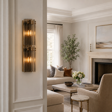 24.2" Delsie Fluted Glass Wall Light in Brass with Smoke Glass, Living Room Scene