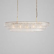 54" Ghiaccio Oval Textured Glass Chandelier with Clear Glass and Brass Finish, Light On