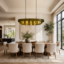 54" Ghiaccio Oval Textured Glass Chandelier with Green Glass and Bronze Finish in a Dining Room