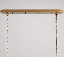 Brass Canopy Detail of Ghiaccio Oval Textured Glass Chandelier