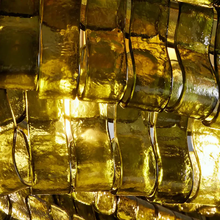 Close-Up of Green Textured Glass and Brass Frame Detail on Ghiaccio Oval Chandelier