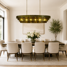 64" Ghiaccio Oval Textured Glass Chandelier with Green Glass and Brass Finish in a Dining Room