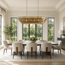 64" Ghiaccio Oval Textured Glass Chandelier with Smoke Glass and Bronze Finish in a Dining Room