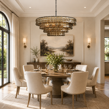 36" Ghiaccio Round Textured Glass Chandelier with Smoke Glass and Bronze Finish in a Living Room