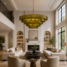 48" Ghiaccio Round Textured Glass Chandelier with Green Glass and Brass Finish in a Living Room