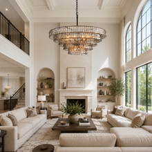48" Ghiaccio Round Textured Glass Chandelier with Smoke Glass and Bronze Finish in a Living Room