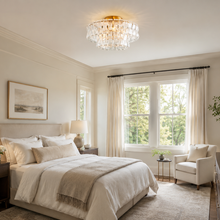 Ghiaccio Textured Glass Flushmount Light with Clear Glass and Brass Finish in a Bedroom
