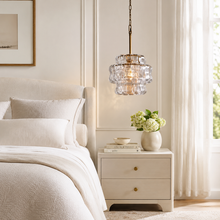 Ghiaccio Textured Glass Pendant with Clear Glass and Brass Finish in a Bedroom