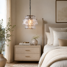 Ghiaccio Textured Glass Pendant with Clear Glass and Bronze Finish in a Bedroom