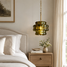 Ghiaccio Textured Glass Pendant with Green Glass and Brass Finish in a Bedroom