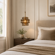 Ghiaccio Textured Glass Pendant with Smoke Glass and Brass Finish in a Bedroom