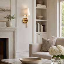 5.5" Rhodes Fabric Wall Light with Brass Finish in a Living Room