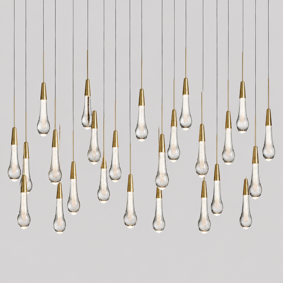 Soltaire Linear Bubble Glass Raindrop Chandelier, 50-inch brass bubble glass chandelier for dining room, kitchen island, rectangular table, and modern open-plan space