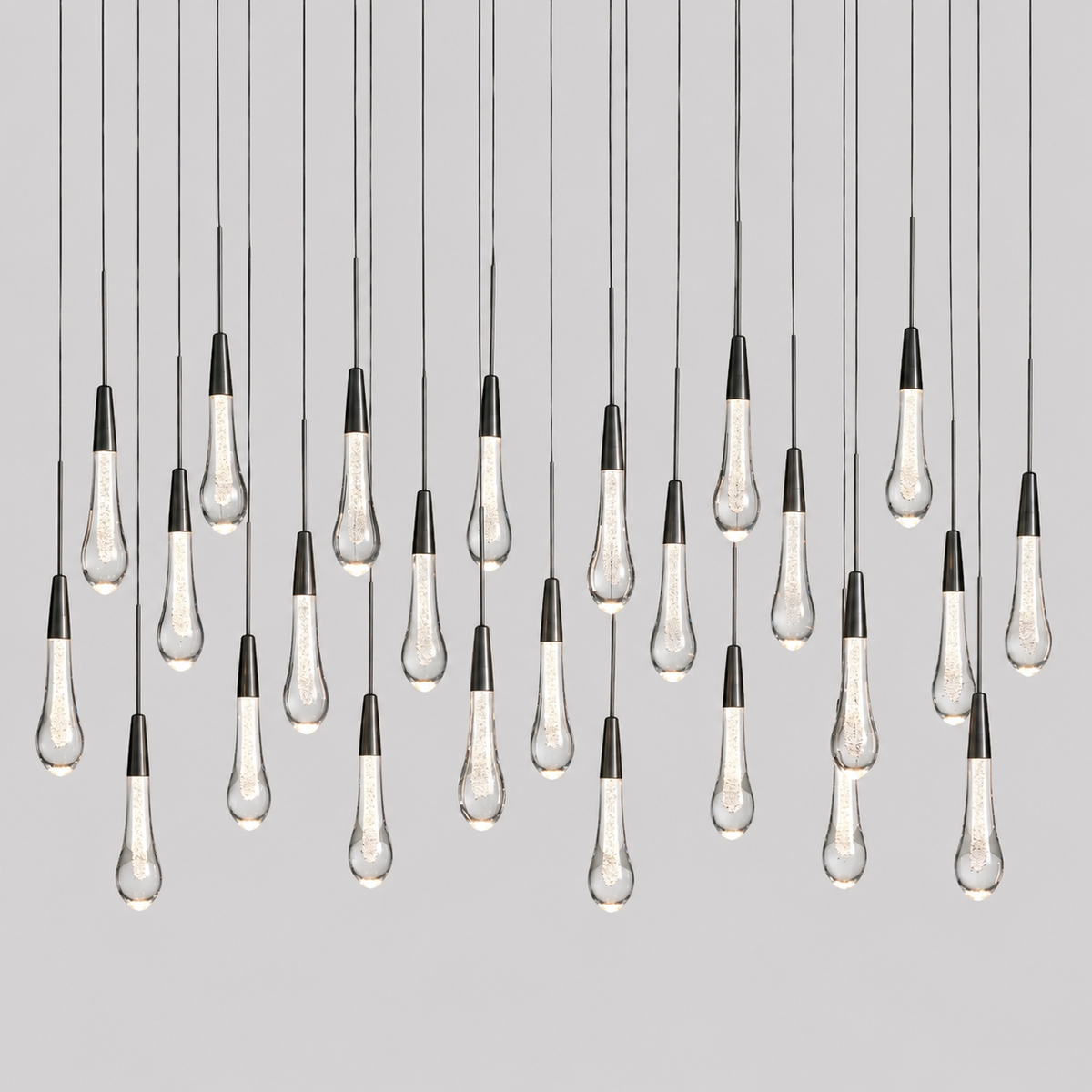 Soltaire Linear Bubble Glass Raindrop Chandelier, 50-inch bronze raindrop chandelier for dining room, kitchen island, transitional interior, and contemporary lighting